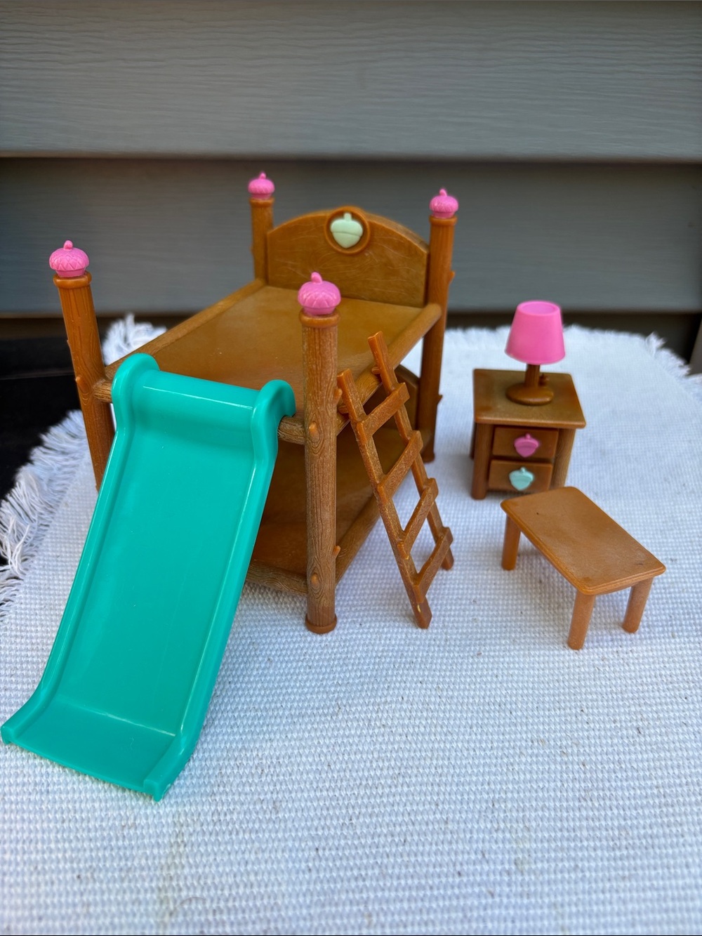 Kids Brown Bunk Bed Playset with Pink Accents and Teal Slide